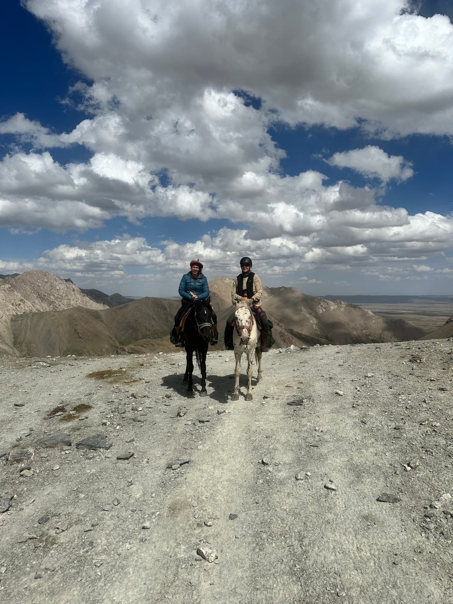 Two riders on mountain pass