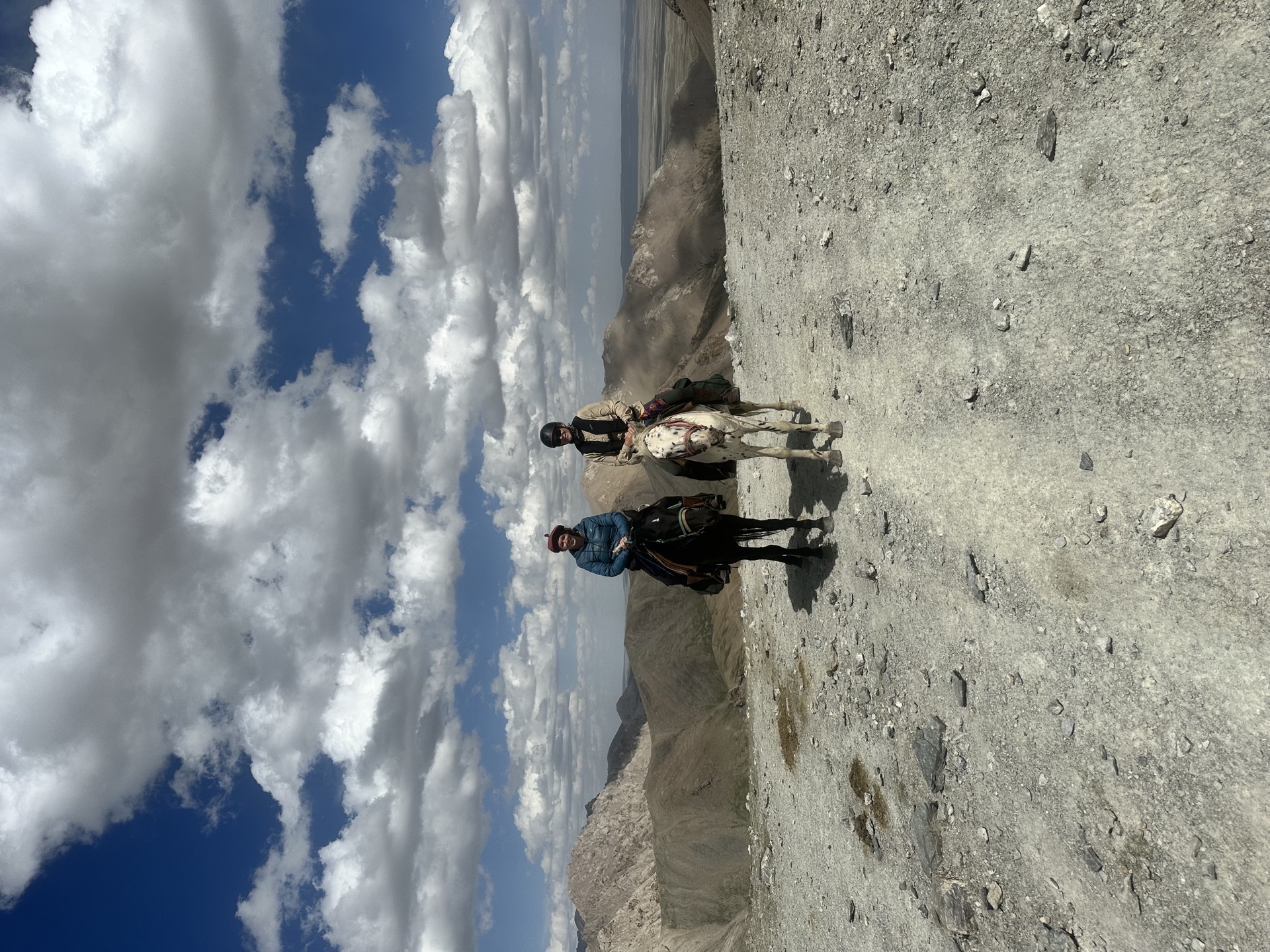 Two riders on mountain pass